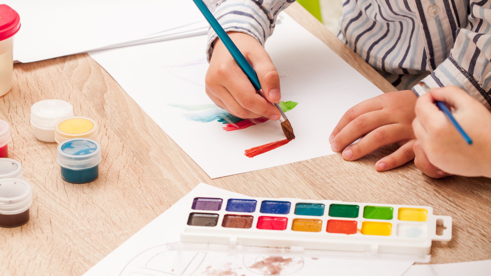 Children painting with watercolors